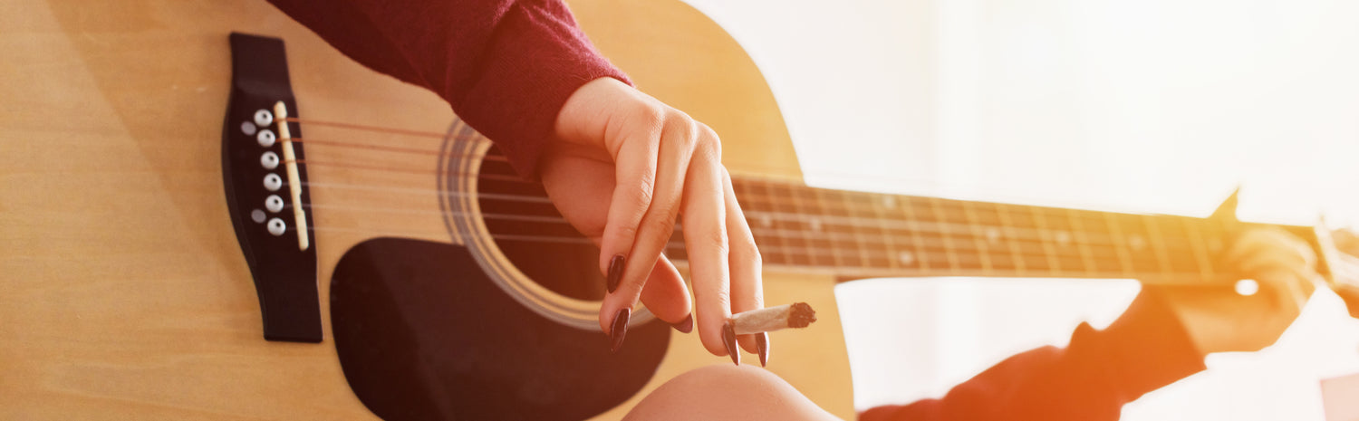 woman smoking and playing guitar